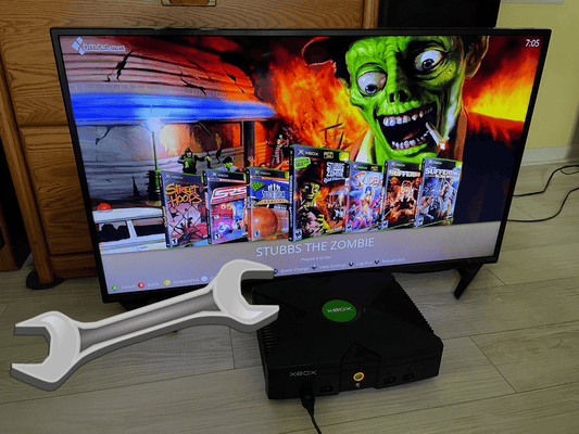 2TB modded OG Xbox console with exposed 7200RPM hard drive and XBMC4Gamers dashboard displayed on a TV
